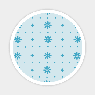 Christmas snowflake with blue stitches on light blue background Magnet